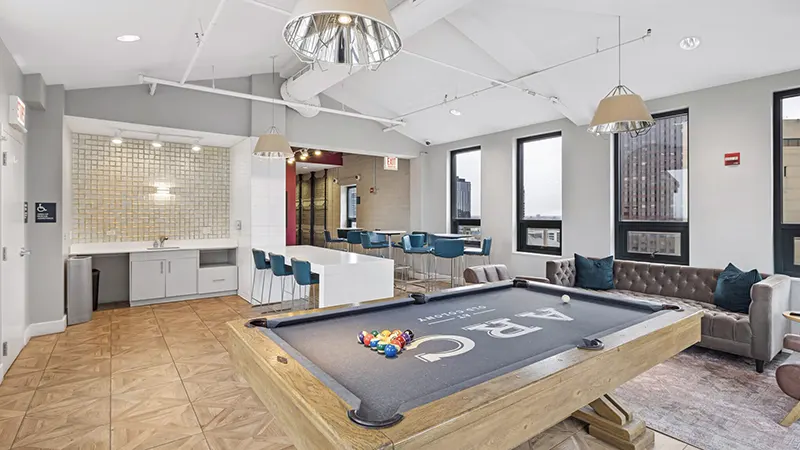Resident club and game room featuring a billiards table at Arc off-campus student housing